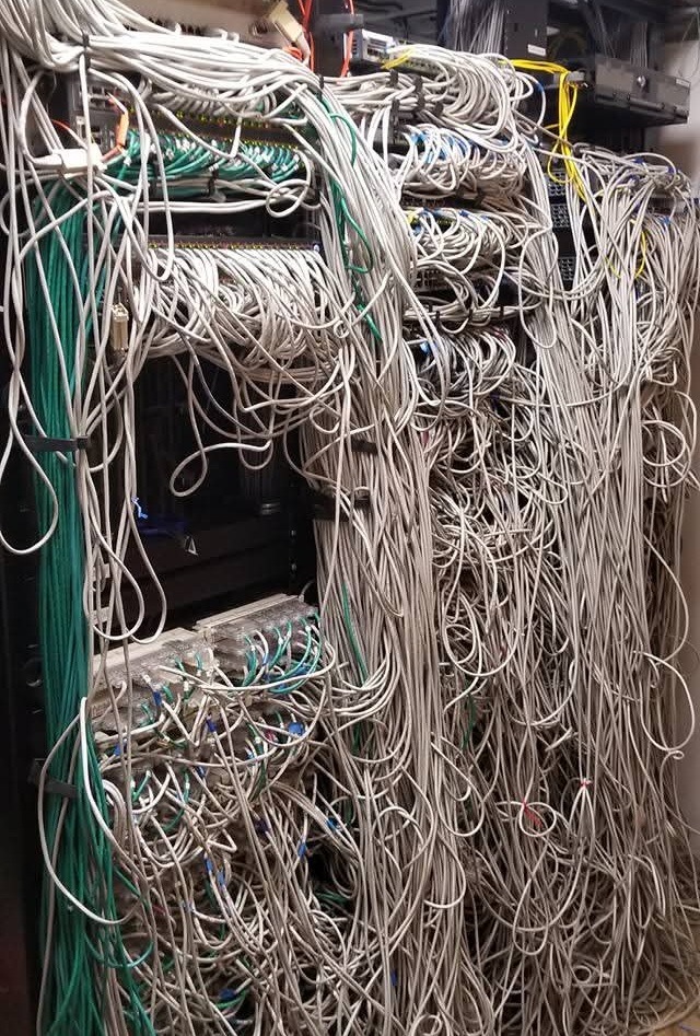 Commercial Network Wiring Disaster Before Cleanup